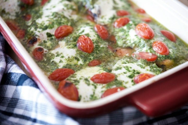 A close up Chicken Margherita in a red casserole dish. 