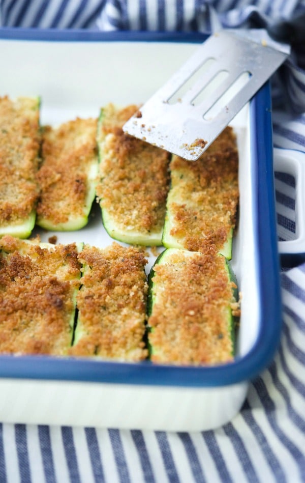 parmesan crusted zucchini in a casserole dish 