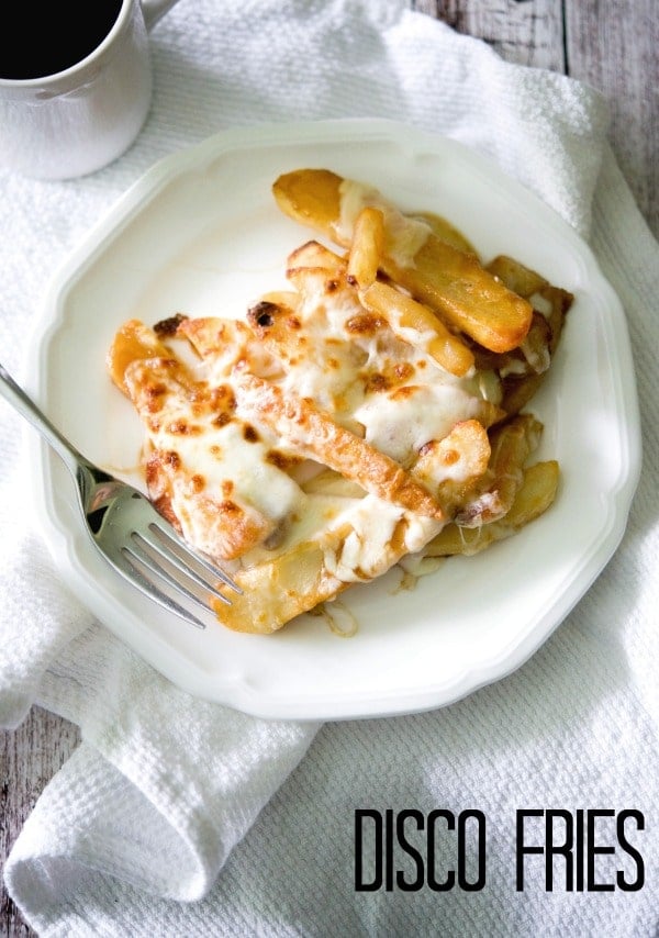 A plate of disco fries with a fork 