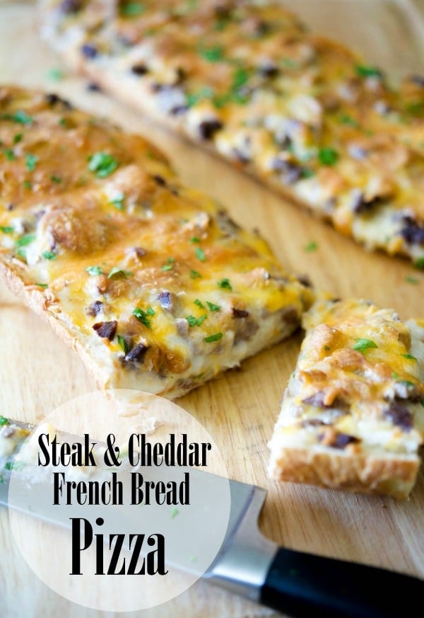 A close up of steak cheddar french bread pizza 