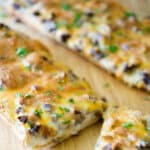 Steak & Cheddar French Bread Pizza made with leftover steak, Cheddar Jack cheese and a horseradish cream sauce is sure to please. 
