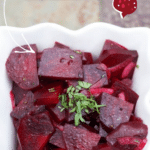 a bowl of pickled beets on a tiled table