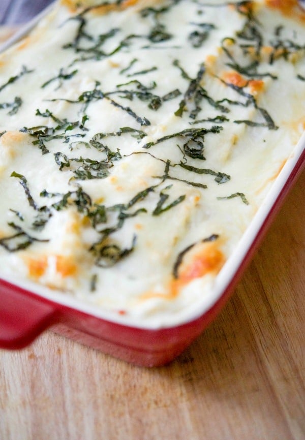 Ratatouille lasagna in a red casserole dish