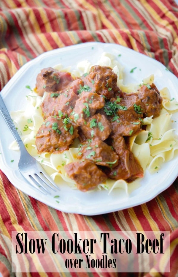 A plate of slow cooker taco beef with a fork 