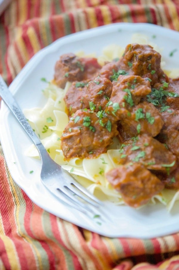 A plate of Slow Cooker Taco Beef over Egg Noodles