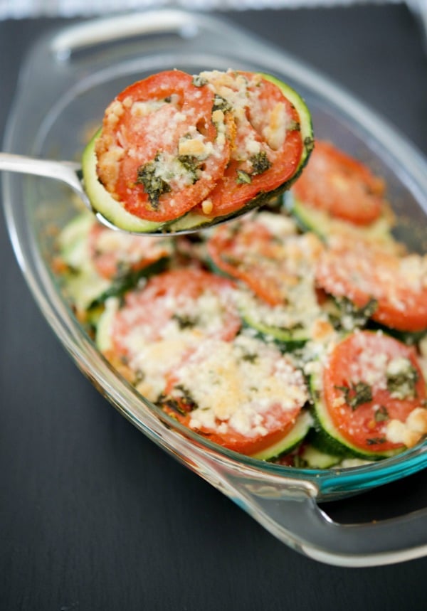 Tomato & Zucchini Gratin made with garden fresh plum tomatoes, zucchini, basil and grated Pecorino Romano cheese is a tasty vegetable side dish that tastes great with any meal. 