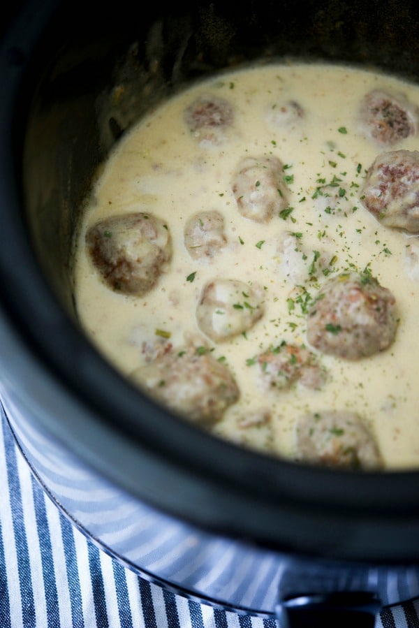 A close up of a pot of steak diane meatballs