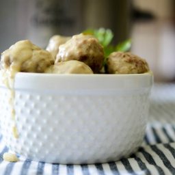 A close up of a bowl of steak diane meatballs