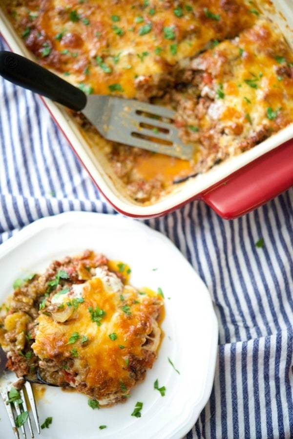 A plate of food with a fork, with Moussaka and Casserole