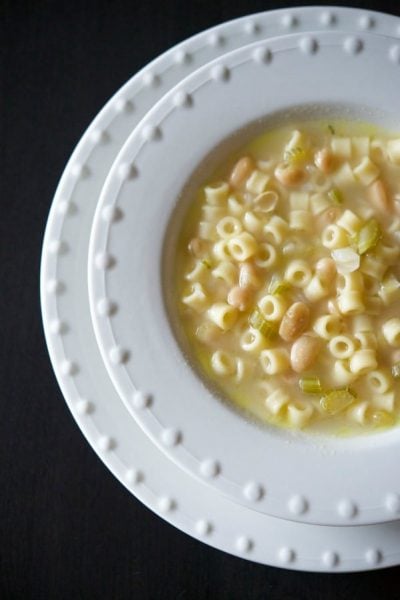 Tuscan White Bean Soup in a white bowl.