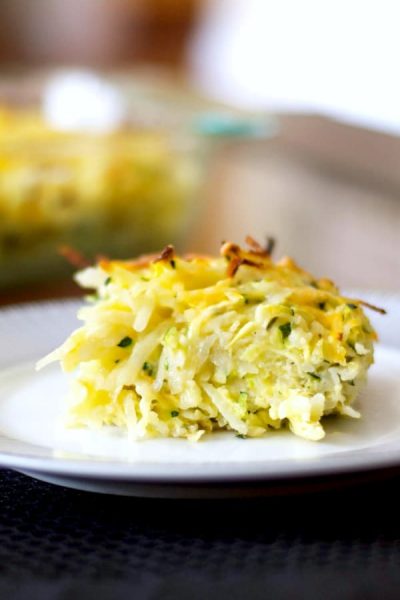 A close up of a plate of food, with Potato and Zucchini