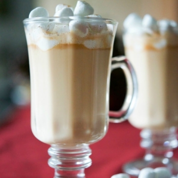 A close up of a glass of Butterscotch Eggnog Hot Chocolate.