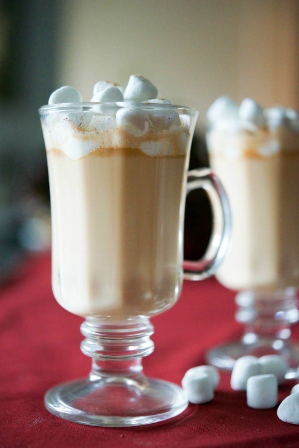 A close up of a glass of Butterscotch Eggnog Hot Chocolate.