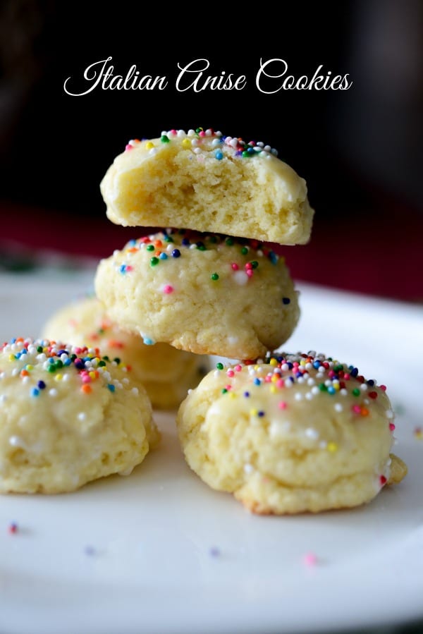 A close up of Italian Anise Cookies stacked on a plate