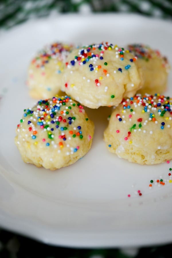 Italian Anise Cookies traditionally are a soft, licorice flavored cookie covered with a powdered sugar glaze and nonpareil's sprinkled on top.