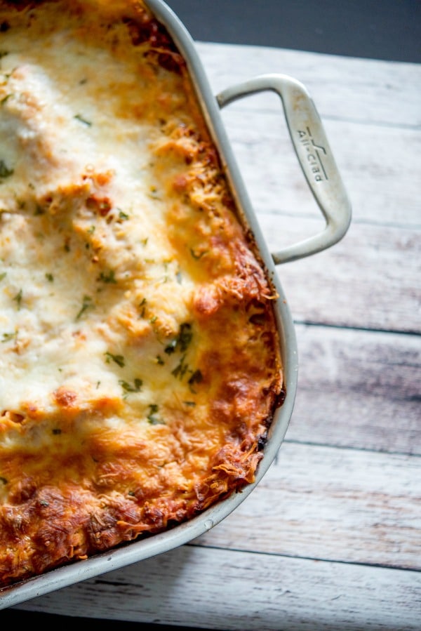 Lasagna made with a mixture of ricotta and mozzarella cheeses, layered with marinara sauce and cooked until hot and bubbly. It's the perfect Italian meal for large crowds or Sunday family dinners.