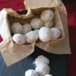 Pecan Snowballs are a rich, buttery pecan cookie rolled in confectioners sugar and make a delicious addition to your holiday cookie platters.  