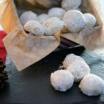 Pecan snowball cookies on a slate tray