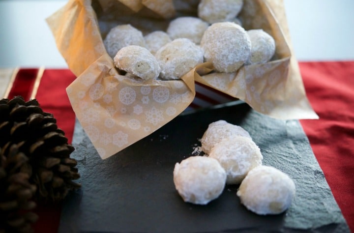 Pecan snowball cookies on a slate tray