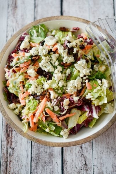 Bleu cheese chopped salad in a wooden bowl.