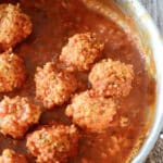 Chicken and Rice Meatballs made with ground chicken, fresh herbs and long grain rice cooked in a tomato sauce is a healthy dinner alternative.