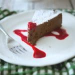 A piece of cake on a plate, with Chocolate and Cherry fudge