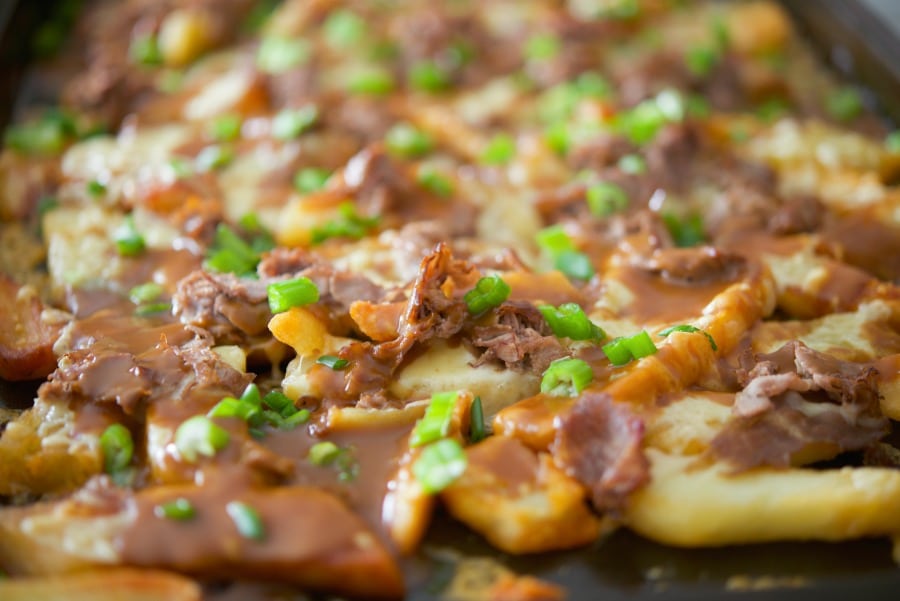 A close up of food of Blarney Fries on a sheet pan. 