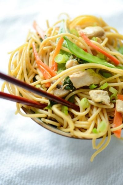 Chicken Lo Mein in a bowl with chopsticks.