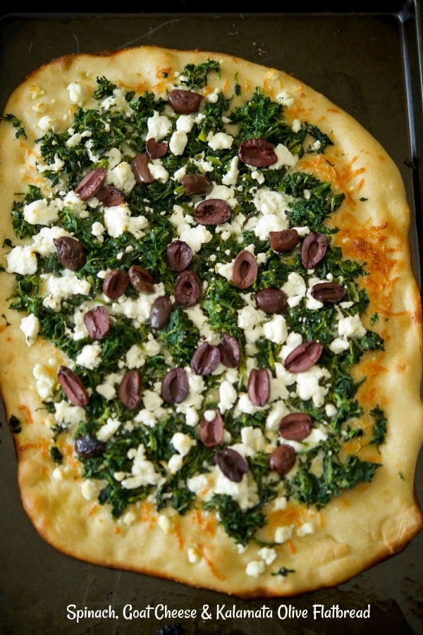 Flatbread topped with spinach, crumbled Goat cheese and Kalamata olives. 