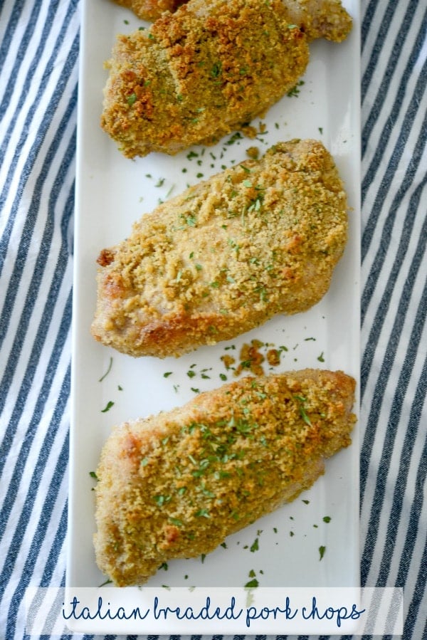 Italian Breaded Pork Chops on a white plate. 