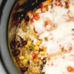 If you're looking for a healthy, quick and easy weeknight meal, this Slow Cooker Tex Mex Chicken and Rice made with black beans, corn, salsa and boneless chicken breasts is definitely for you.