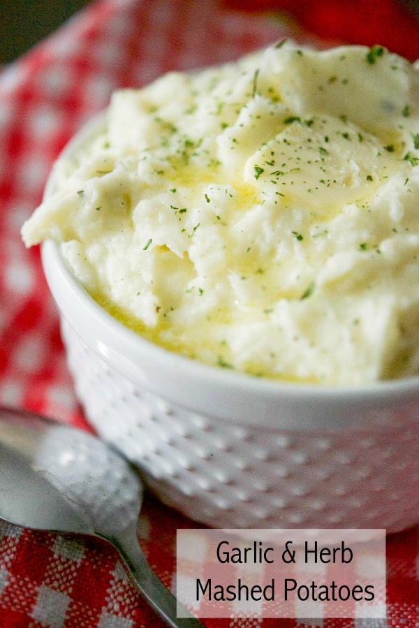 Creamy Garlic & Herb Mashed potatoes made with Russet potatoes, Garlic & Herb Boursin Cheese, heavy cream and salted butter. 