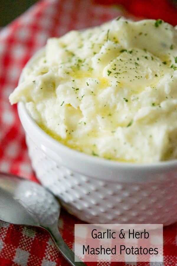 Creamy Garlic & Herb Mashed potatoes made with Russet potatoes, Garlic & Herb Boursin Cheese, heavy cream and salted butter. 