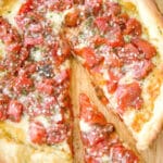 Deep Dish Pizza is a simple weeknight meal made with fire roasted tomatoes, Italian seasoning and a blend of shredded cheeses.