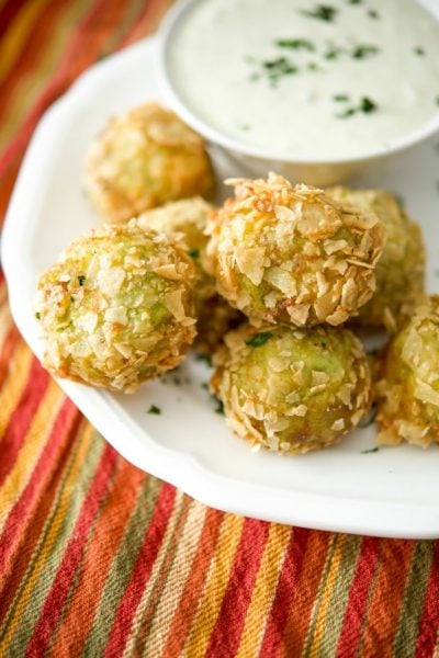 Guacamole Bites on a plate with dipping sauce.