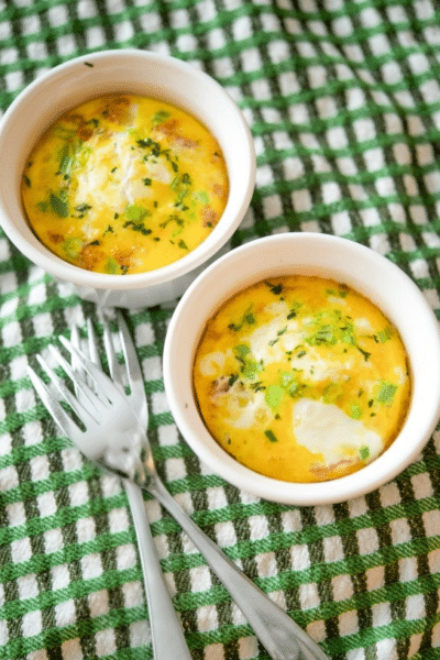 two ramekins with baked eggs