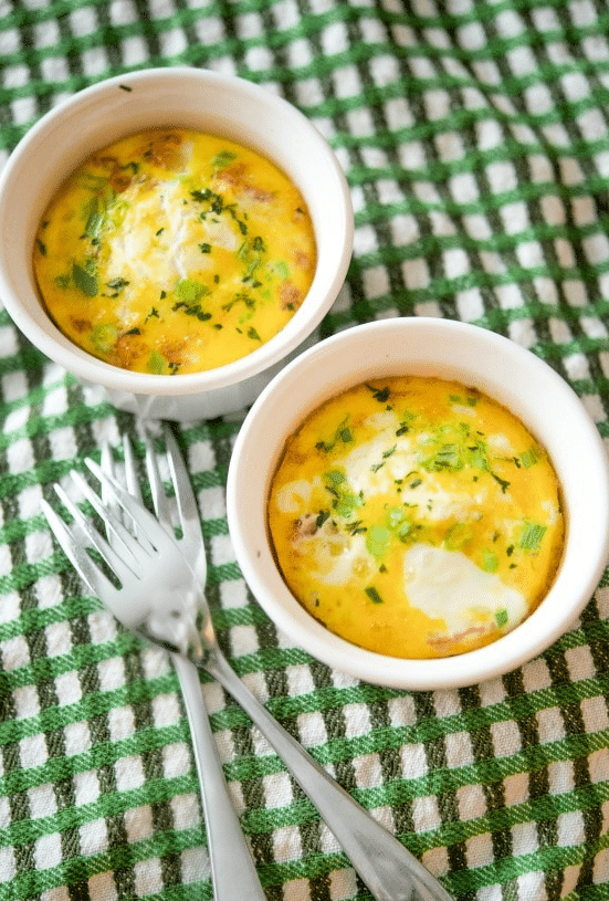 two ramekins with baked eggs