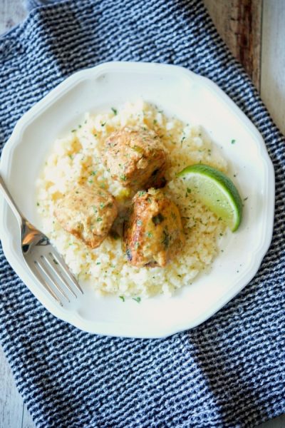 Coconut Lime Chicken Meatballs on a plate with a lime.