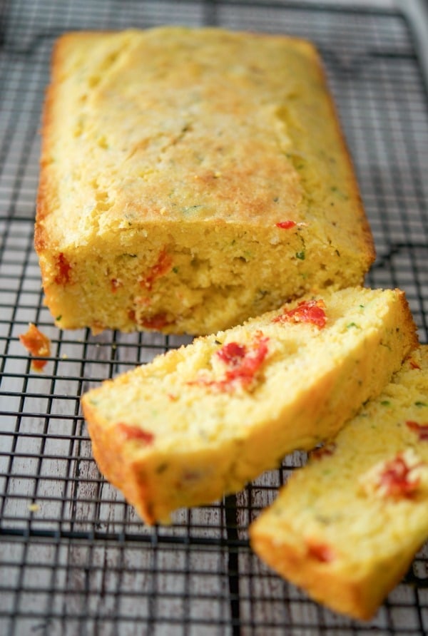 Savory Italian Cornbread made with yellow cornmeal, zucchini, sun dried tomatoes, rosemary and grated Pecorino Romano cheese.