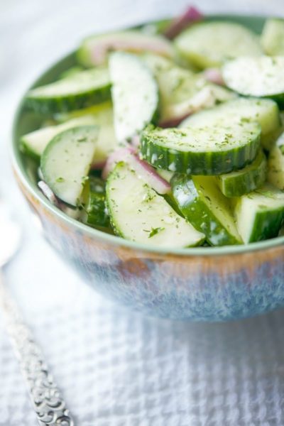Asian Cucumber Salad made with seedless English cucumbers & red onion in an Asian honey mustard dressing is a tasty light salad that's perfect for cookouts.