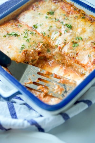 Grilled Zucchini Lasagna in a dish with a piece cut out.