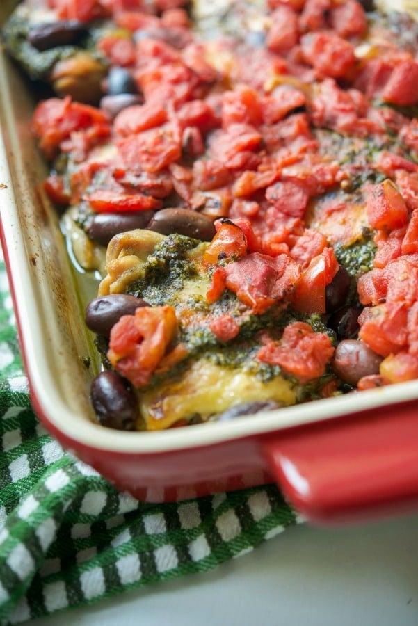 Chicken thighs topped with fresh basil pesto, fire roasted diced tomatoes and Kalamata olives; then baked until tender and juicy.