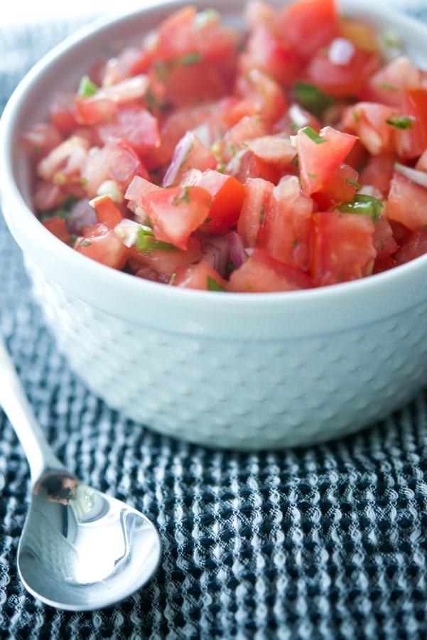 Pico de Gallo; a cold Mexican dip made with fresh tomatoes, onions, cilantro, jalepeno peppers and lime juice is deliciously refreshing.