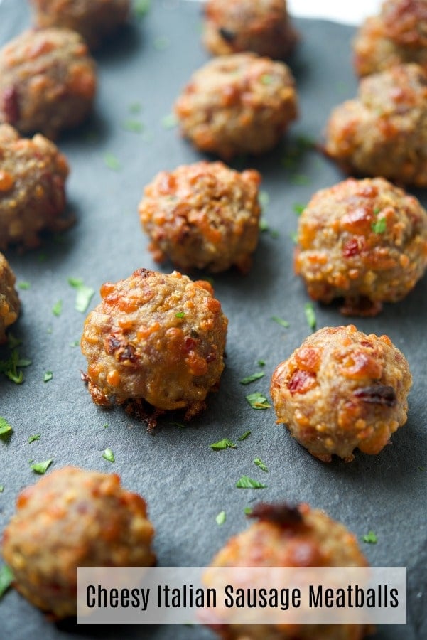 These Cheesy Italian Sausage Meatballs made with sun dried tomatoes, fresh basil, mozzarella and Pecorino Romano cheese is sure to please the game day snacker in your family. 