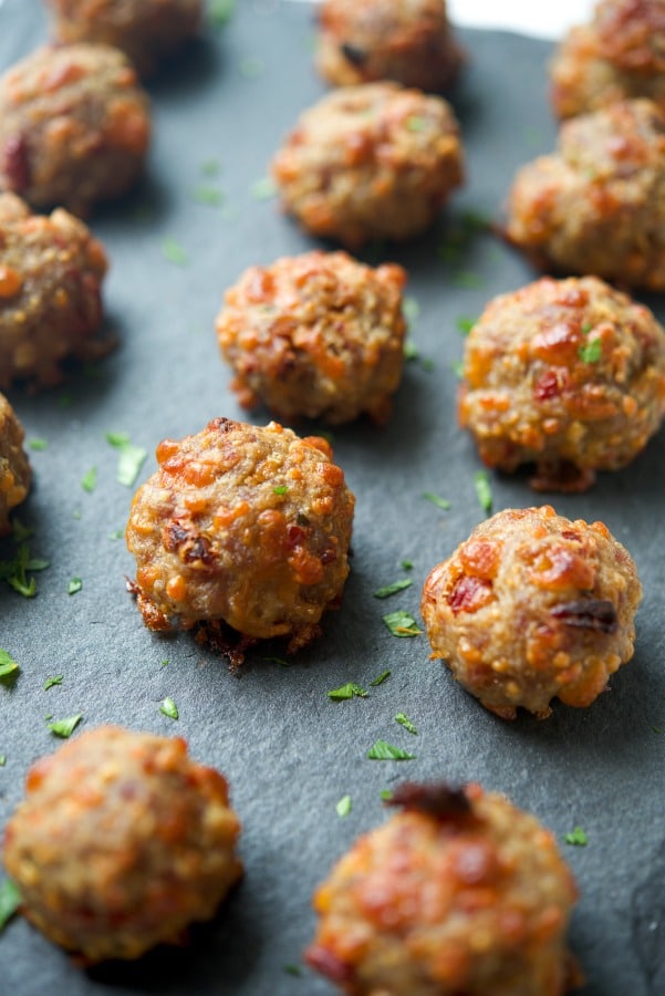 Cheesy Italian Sausage Meatballs on a slate board. 