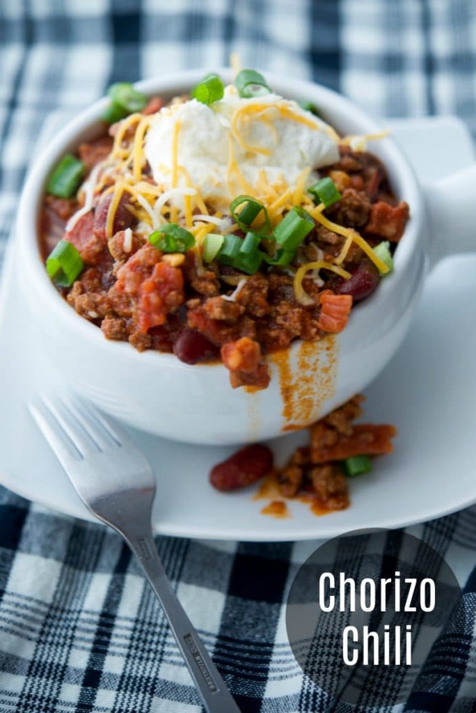 A bowl of chorizo chili with a fork 