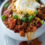 Chorizo Chili made with lean ground beef, Portuguese chorizo, kidney beans, fire roasted tomatoes and seasonings is comfort food at its best.  