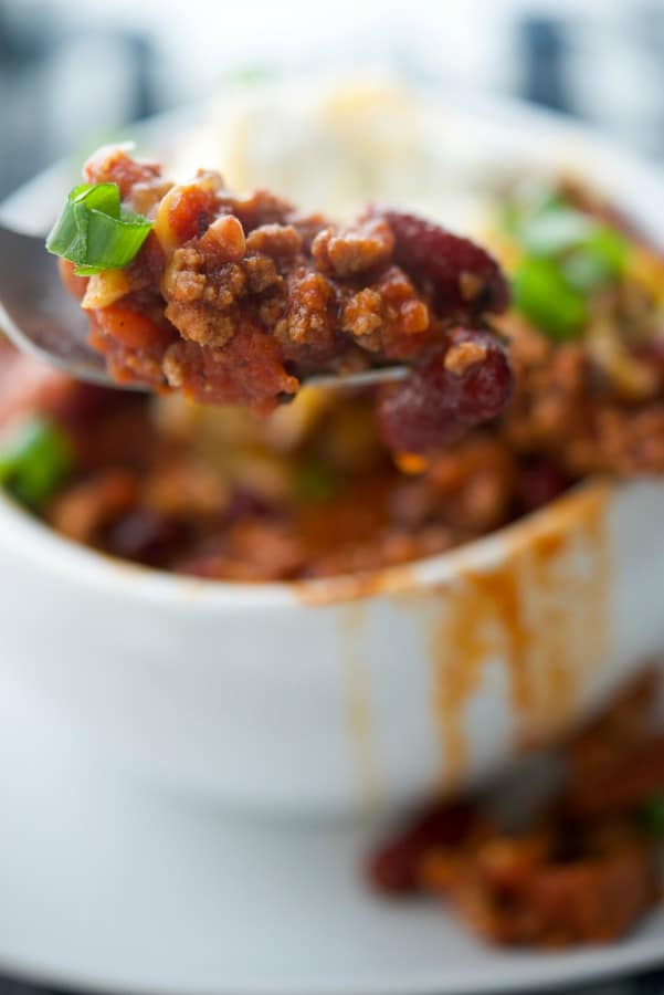 A close up of Chorizo chili on a spoon