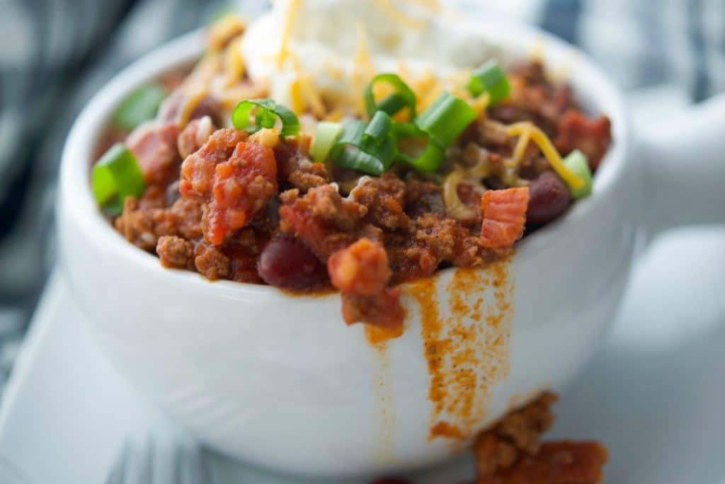 A close up of a bowl of chorizo chili 