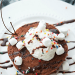 Chocolate pancakes with sprinkles on a plate